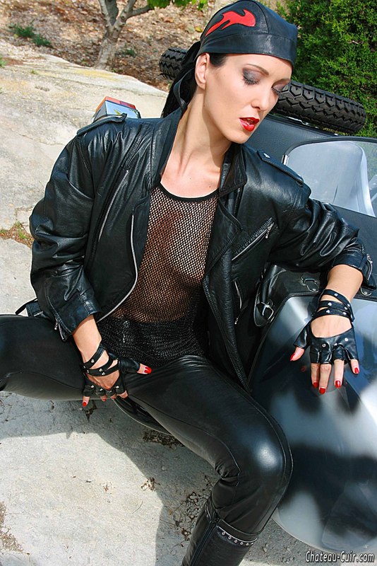 Leather Biker Sex - Tall Biker Girl In Leather Uniform And Bandanna Strips Outdoors By The Bike  And Flashing Her Tits - YOUX.XXX