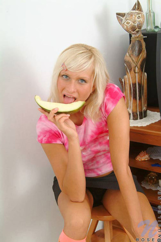 cute teen eats melon
