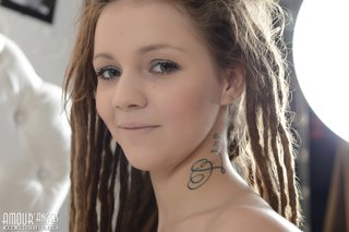tattooed teen with dreads