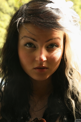 wonderful tattooed teen posing