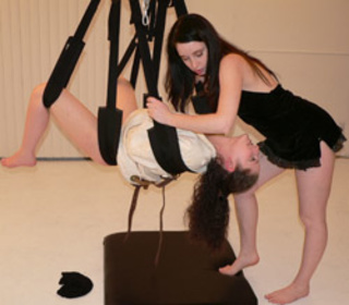 long-haired brunette jeering suspended