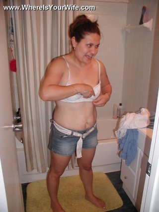 plump housewife undresses takes