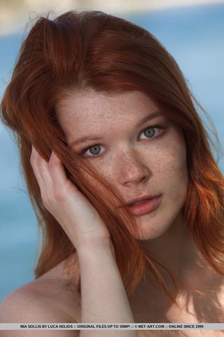 young redhead takes off