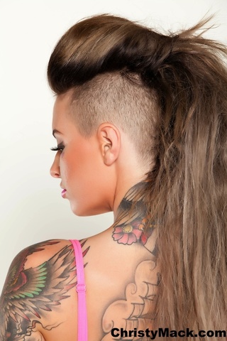 tattooed chick posing alluring