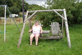 gordas abuela sits wooden