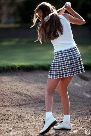 teenage chick playing golf