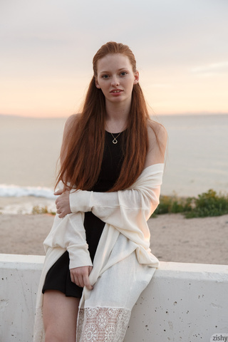 alluring redhead chick posing