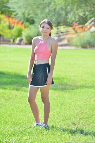 smiling teen gal toying