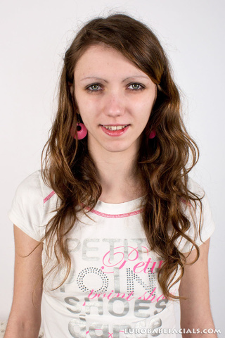 blue-eyed brunette covers face