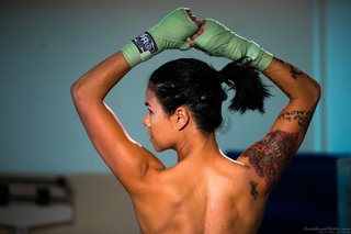 exotic tattooed fighter ponytail
