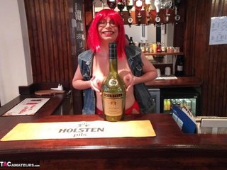 redhead waitress exposes large