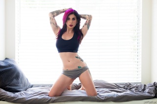 tattooed purple hair cutie