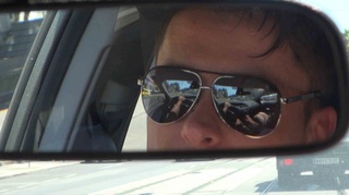 couple driving car busy
