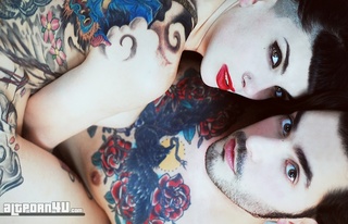 tattooed girl poses guy