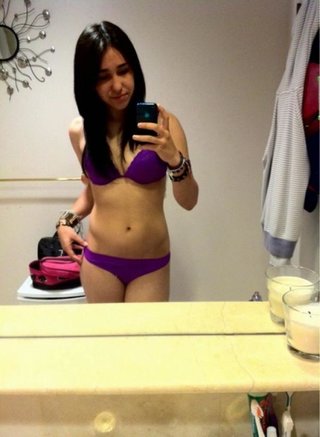 black-haired nena poses toples